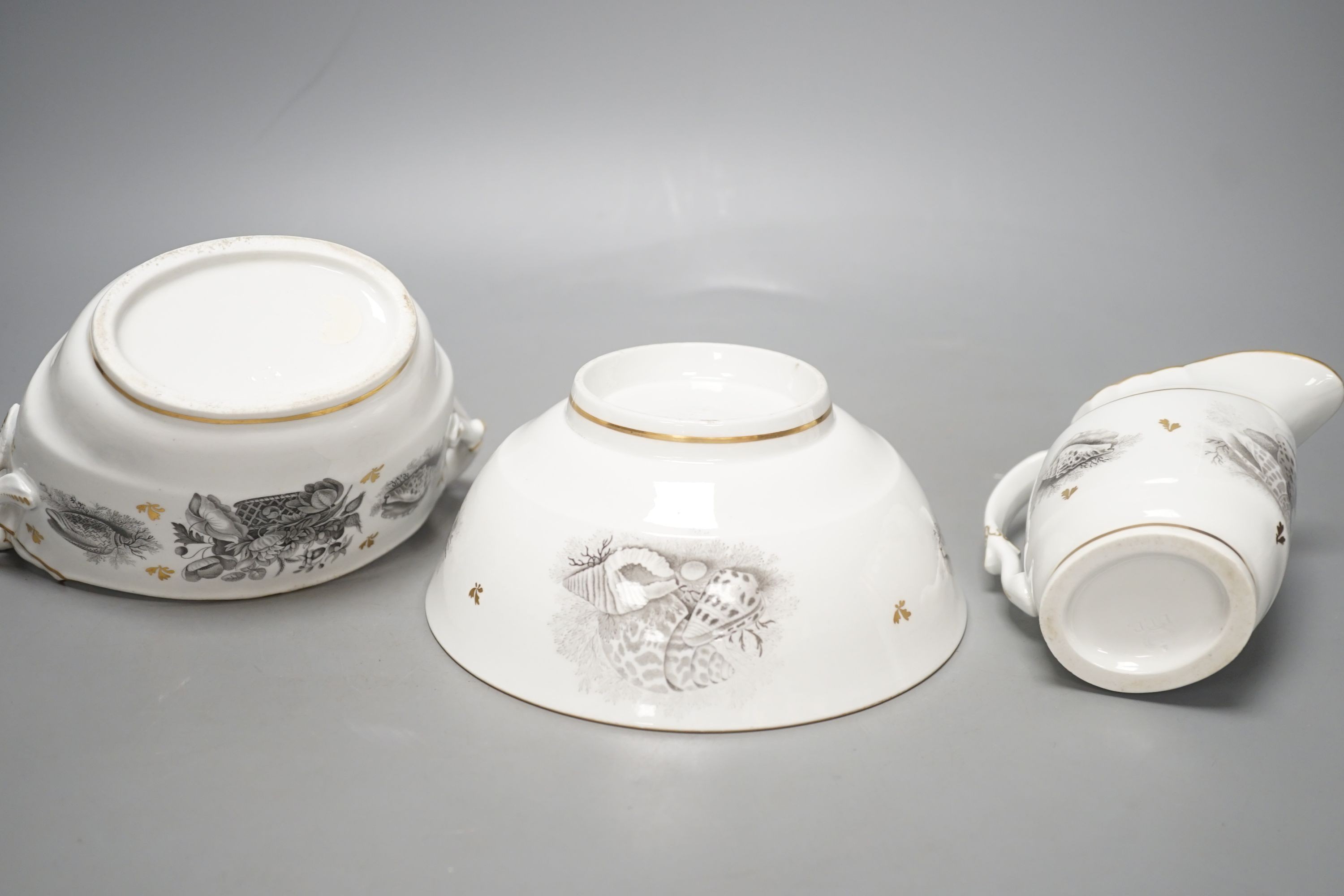 A Barr Flight and Barr cream jug bat printed with baskets of flowers and hell with additional gilded leaves, a matching boat shaped two handled sucrier and a bowl en suite , all with impressed marks. c. 1810